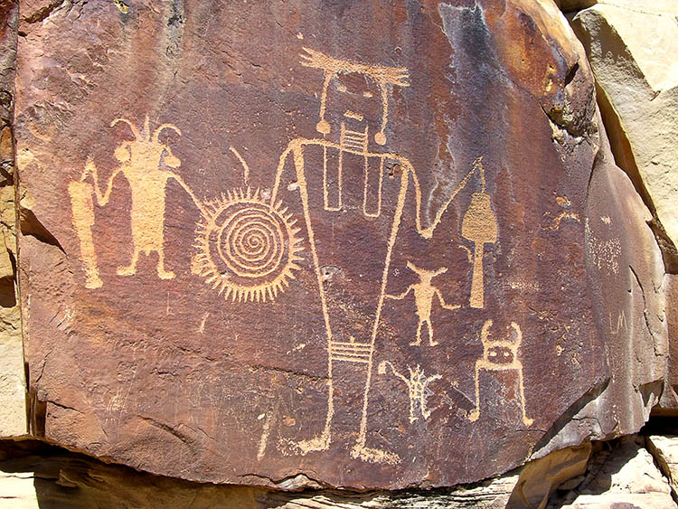 Petroglyphs Images Carved Into Rock Face